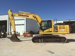 Side of used Komatsu Excavator in yard for Sale